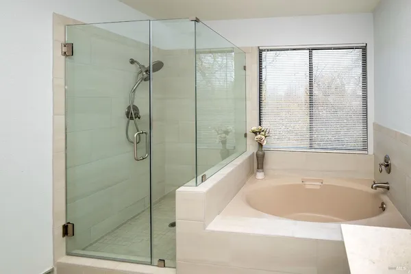 a bathroom with a sink vanity and a mirror
