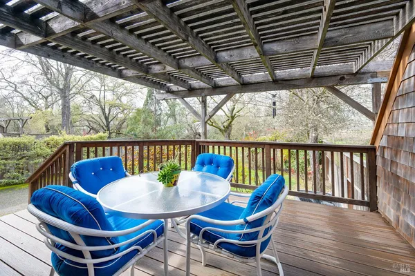 a view of balcony with furniture