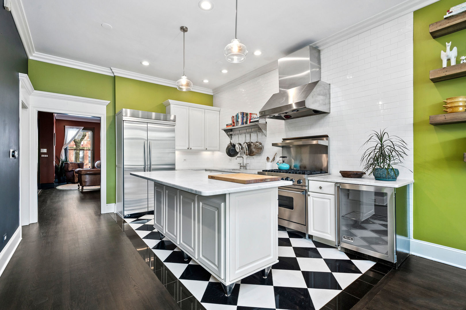 1421 West Lexington Street Chicago, IL 60607 - Photo 12 of 48 a kitchen with stainless steel appliances kitchen island a large stove a sink and a refrigerator