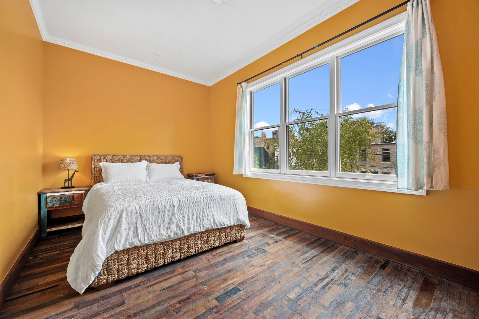 1421 West Lexington Street Chicago, IL 60607 - Photo 27 of 48 a bedroom with a bed and wooden floor