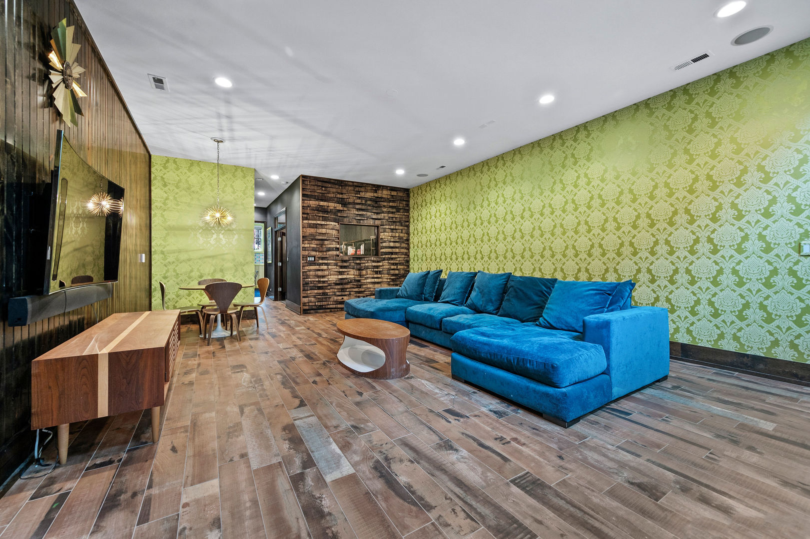 1421 West Lexington Street Chicago, IL 60607 - Photo 35 of 48 a living room with couches and painted walls with wooden floor