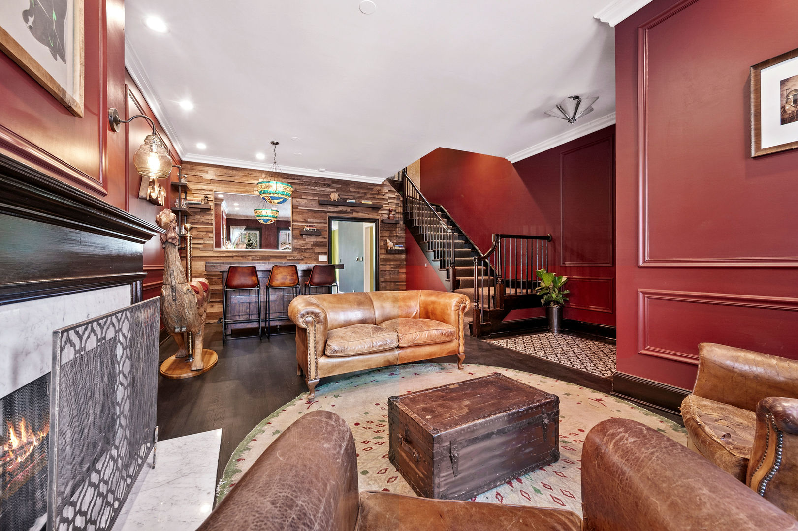 1421 West Lexington Street Chicago, IL 60607 - Photo 6 of 48 a living room with furniture a rug and a chandelier