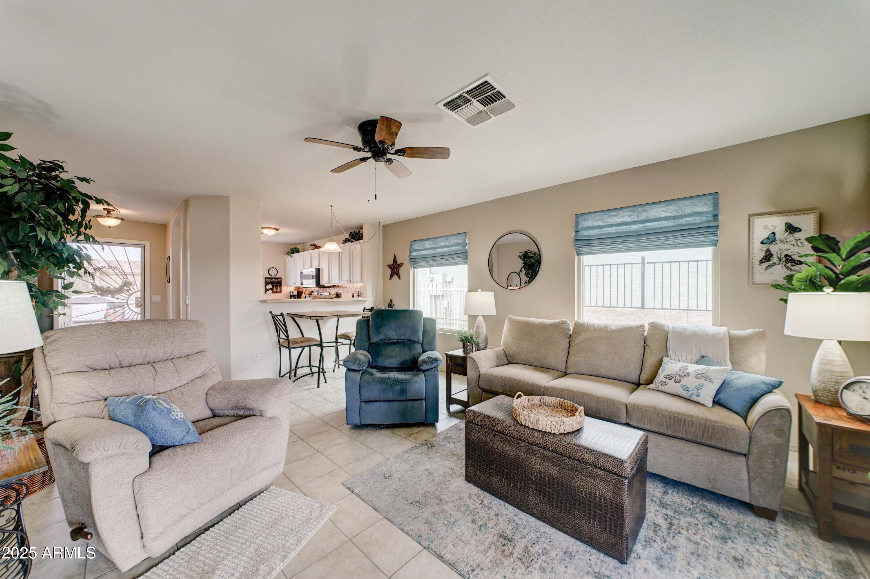 2101 South Meridian Road, Unit 432 Apache Junction, AZ 85120 - Photo 11 of 52 a living room with furniture and a large window