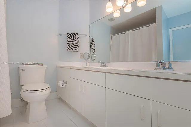 a bedroom with a bed and a book shelf