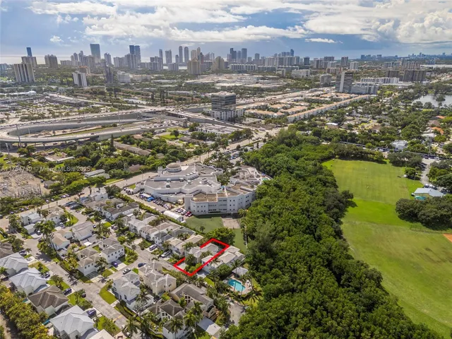 an aerial view of residential building with parking space