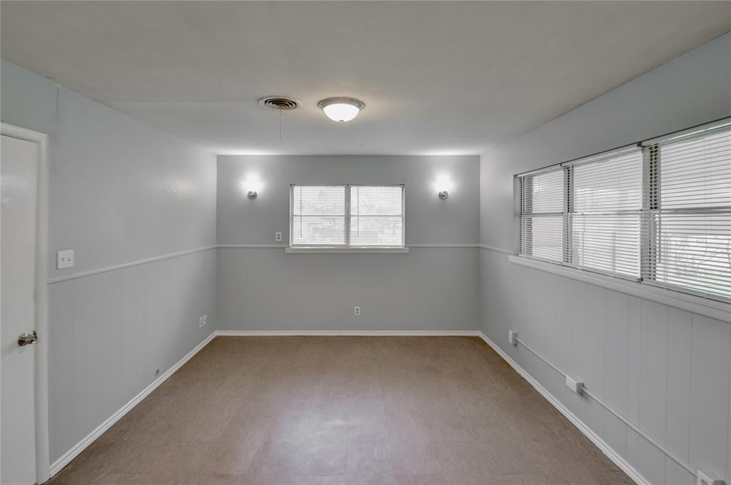 1002 North Stewart Street Azle, TX 76020 - Photo 15 of 29 an empty room with windows