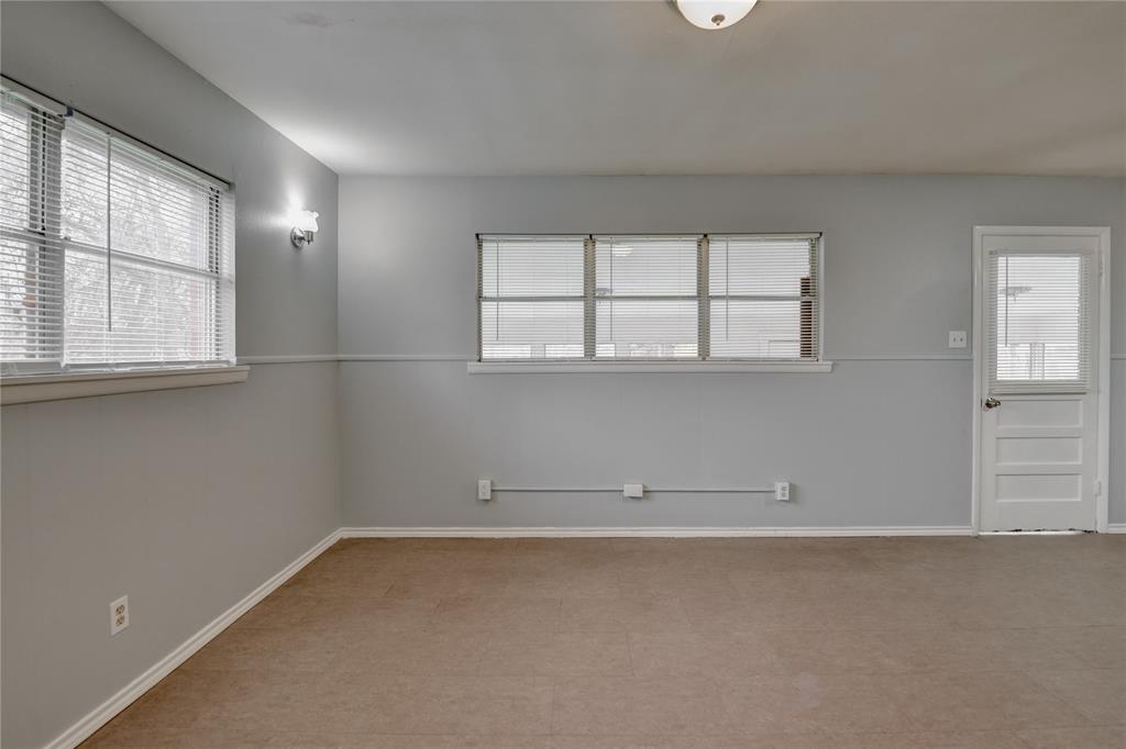 1002 North Stewart Street Azle, TX 76020 - Photo 16 of 29 an empty room with windows