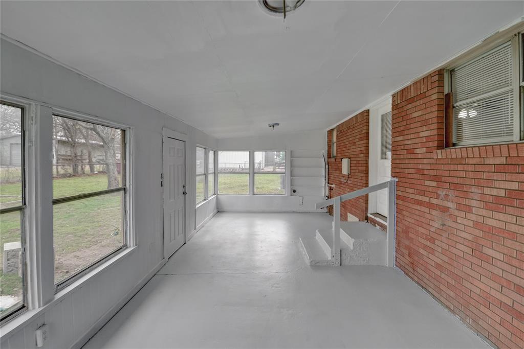 1002 North Stewart Street Azle, TX 76020 - Photo 26 of 29 a view of empty room with floor to ceiling window and room