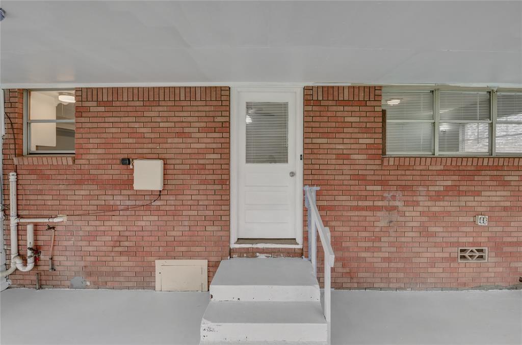 1002 North Stewart Street Azle, TX 76020 - Photo 27 of 29 a brick building with a window