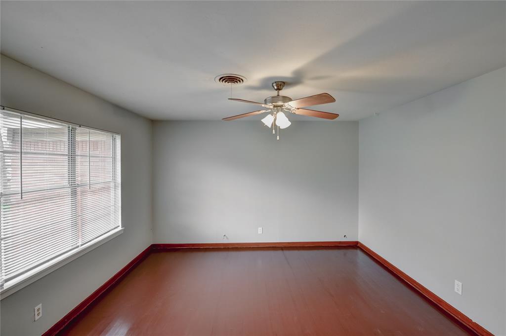 1002 North Stewart Street Azle, TX 76020 - Photo 3 of 29 a view of an empty room with a window