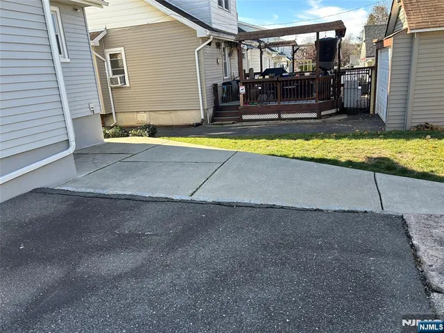 a view of swimming pool with outdoor seating and yard