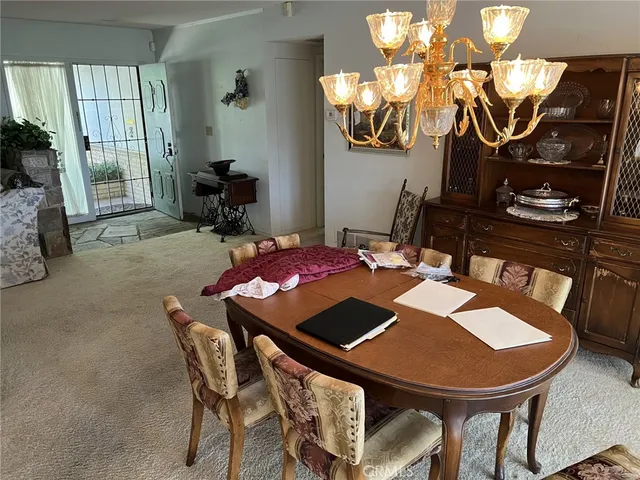 a view of a dining room with furniture and window
