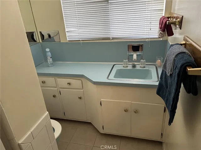 a room with a washing machine and a sink