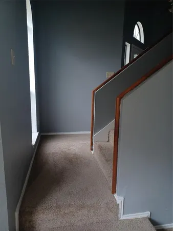 a view of a hallway with staircase
