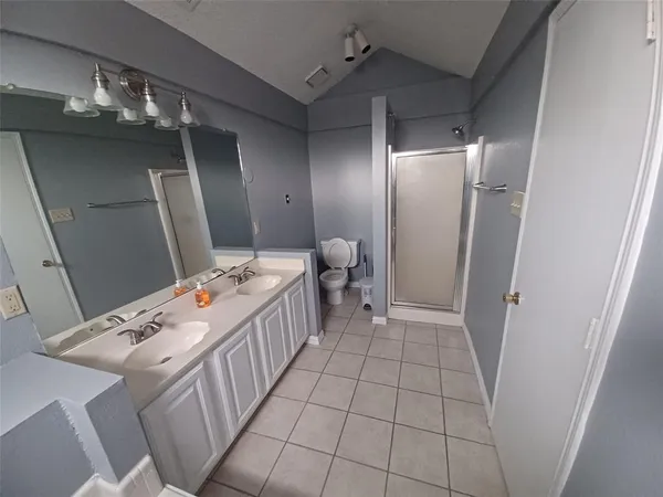 a view of a room with an empty space and a sink