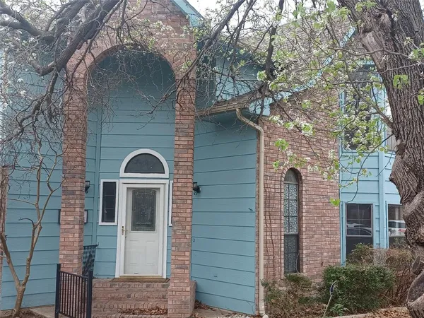 a front view of a house with yard