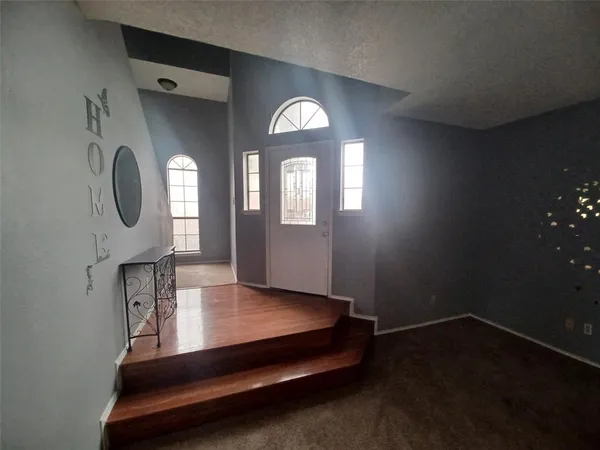 a view of livingroom with furniture and mirror