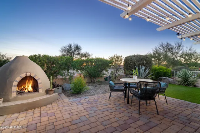 a living room with furniture and a lamp