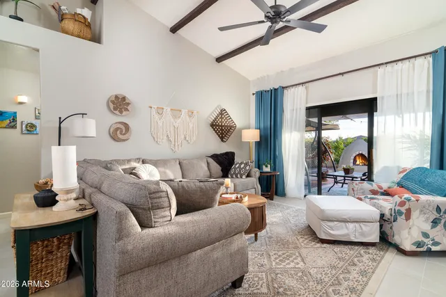 a living room with furniture and a large window