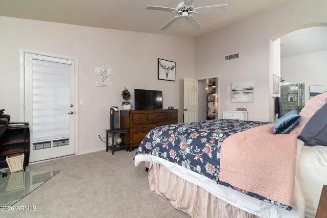 a spacious bathroom with a bathtub sink and mirror
