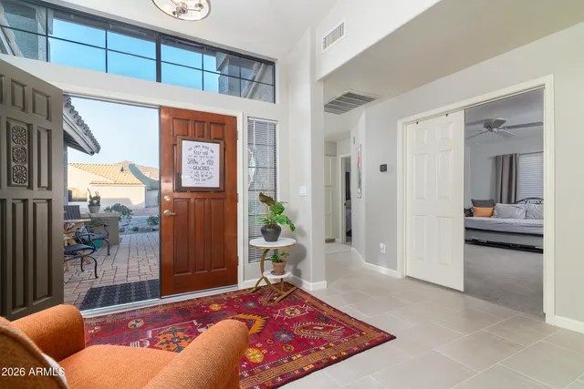 a bathroom with a sink vanity mirror and toilet