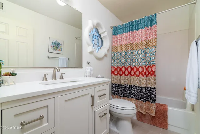 a view of a patio with table and chairs and potted plants