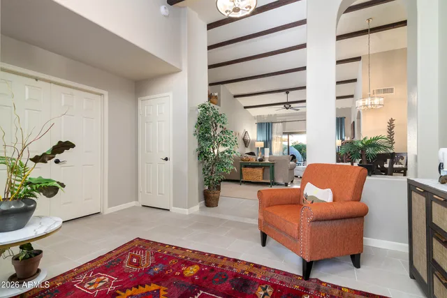 a living room with furniture and a potted plant