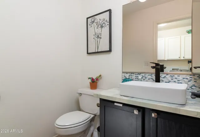 a view of a house with backyard porch and sitting area