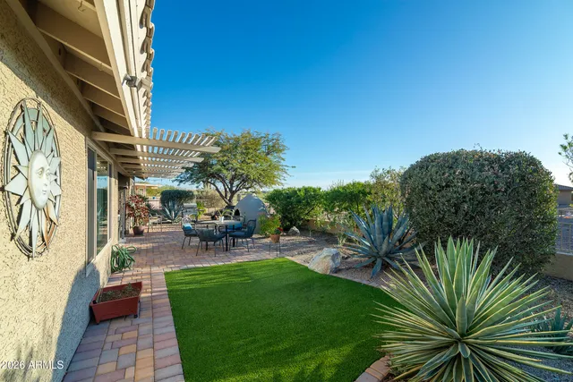 a view of a backyard with a patio