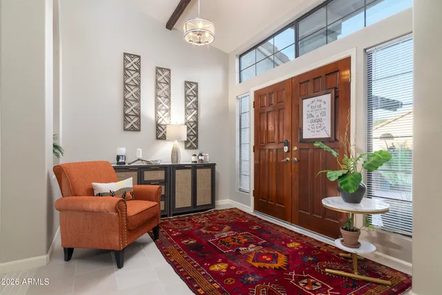 a bedroom with furniture and a potted plant