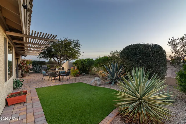 an aerial view of a house with outdoor space