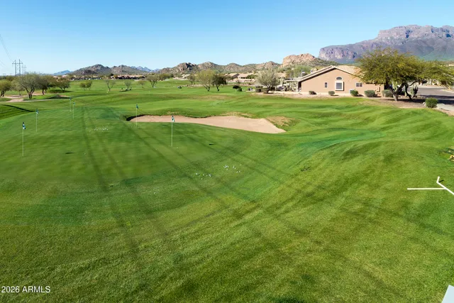 a large white kitchen with stainless steel appliances lots of white cabinets
