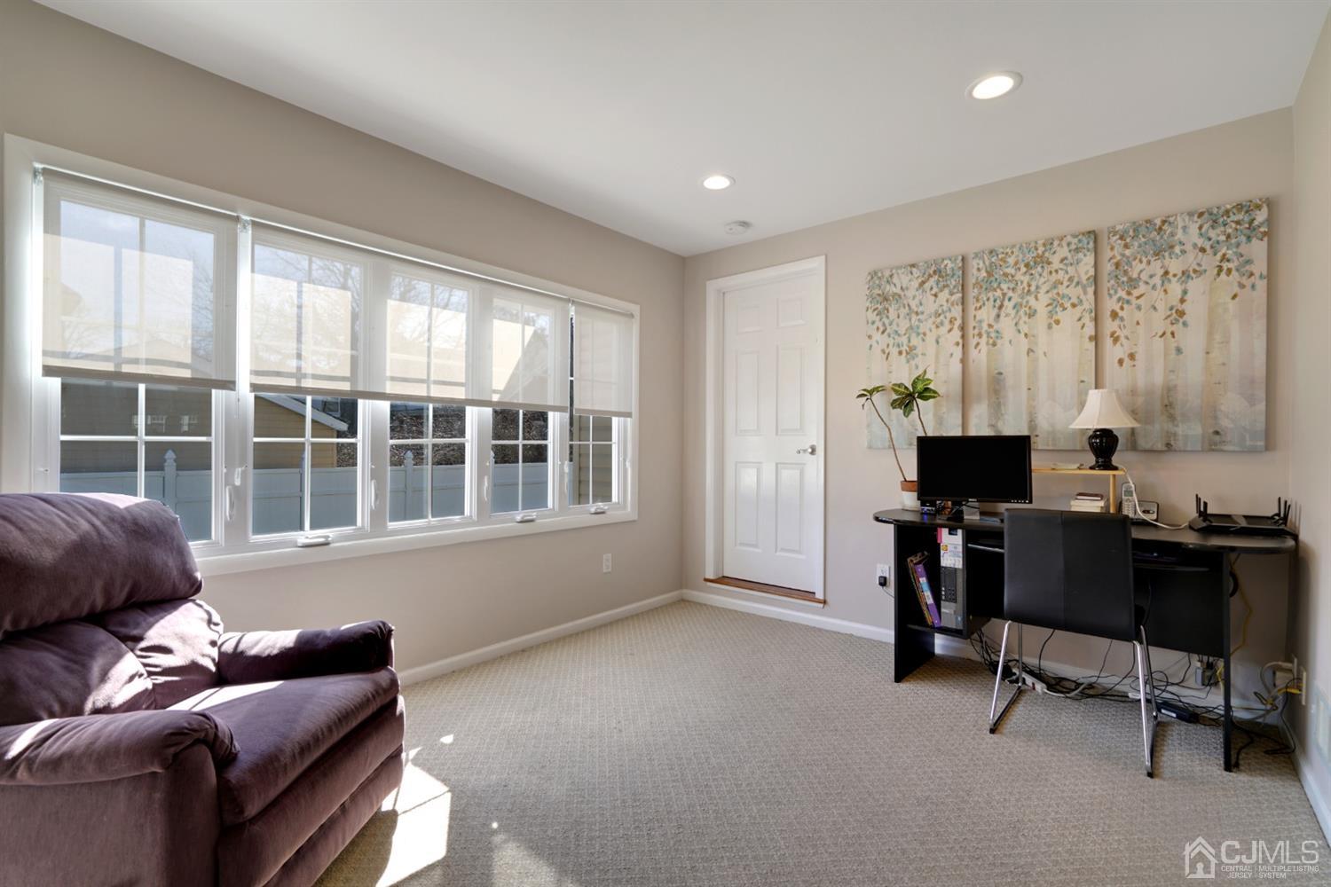 21 Palisade Road Linden, NJ 07036 - Photo 13 of 25 a living room with furniture and a window