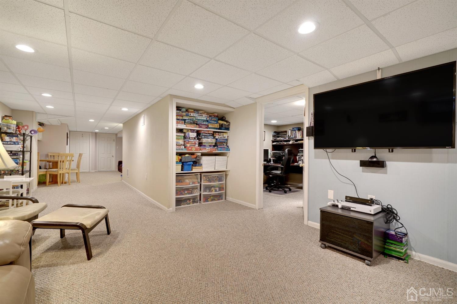 21 Palisade Road Linden, NJ 07036 - Photo 19 of 25 a living room with furniture and a flat screen tv