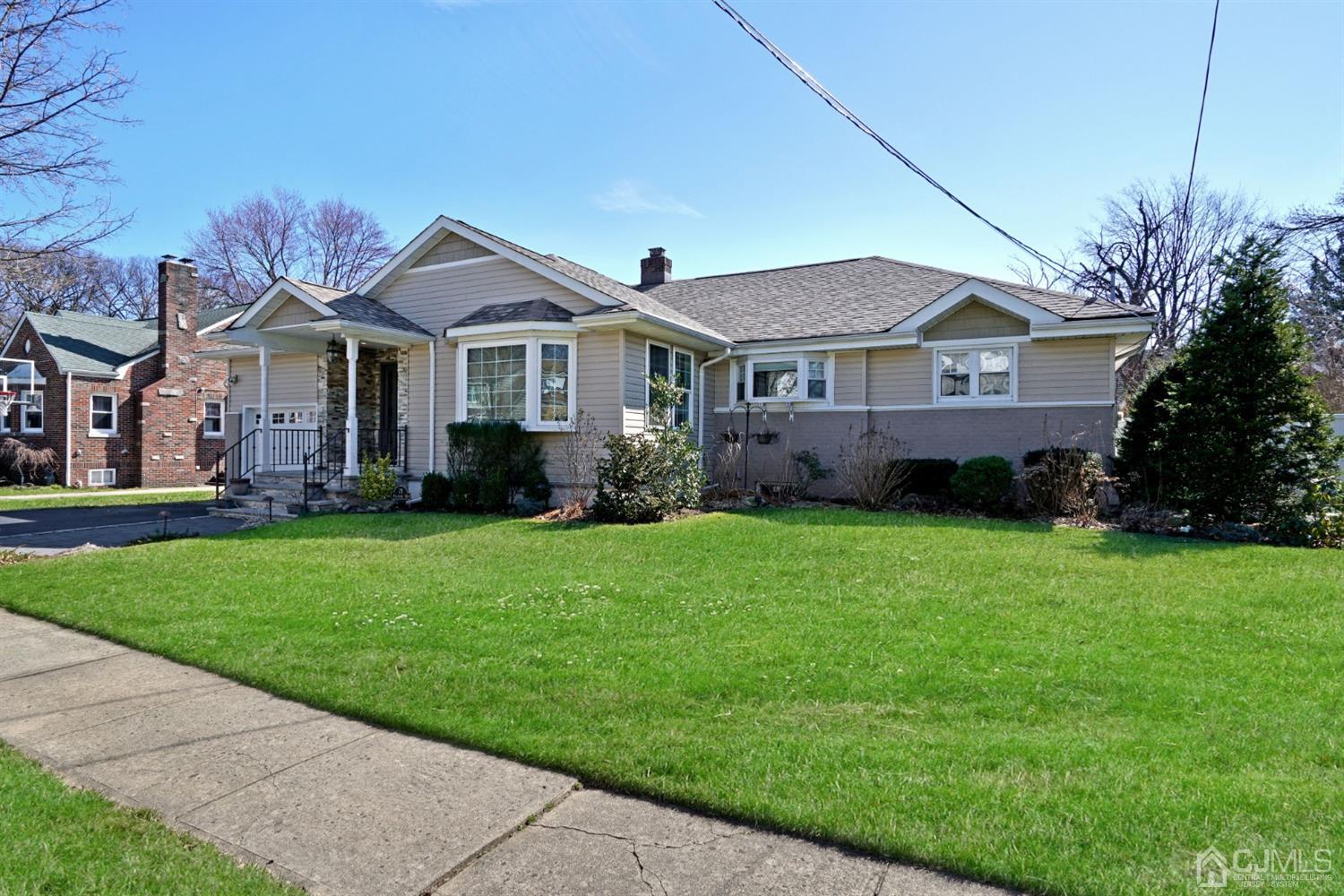 21 Palisade Road Linden, NJ 07036 - Photo 3 of 25 a front view of a house with a garden