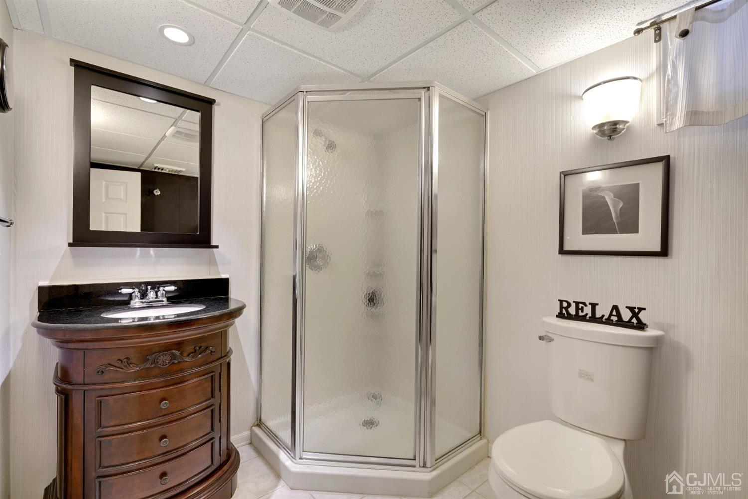 21 Palisade Road Linden, NJ 07036 - Photo 21 of 25 a bathroom with a toilet sink and shower