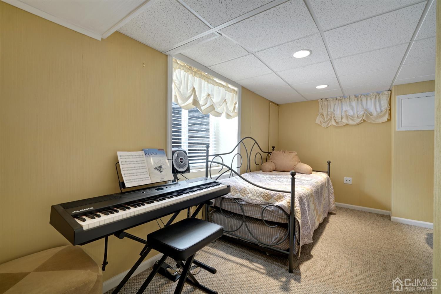 21 Palisade Road Linden, NJ 07036 - Photo 22 of 25 a bedroom with furniture and a window
