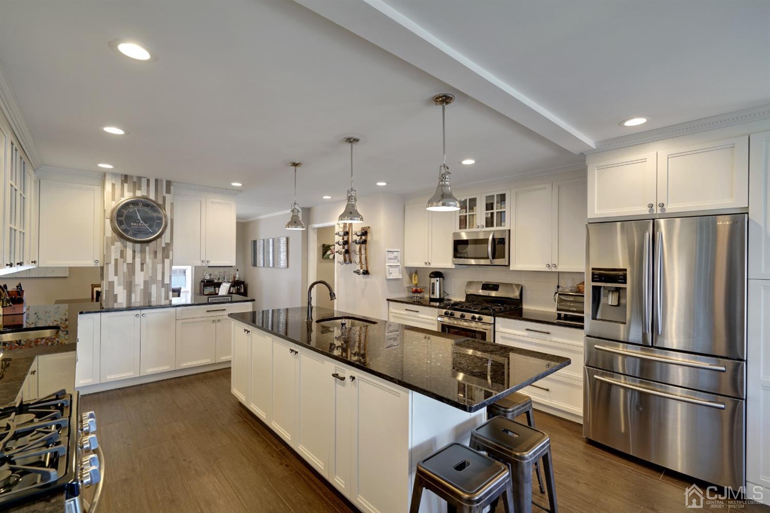 21 Palisade Road Linden, NJ 07036 - Photo 8 of 25 a kitchen with counter top space cabinets and stainless steel appliances