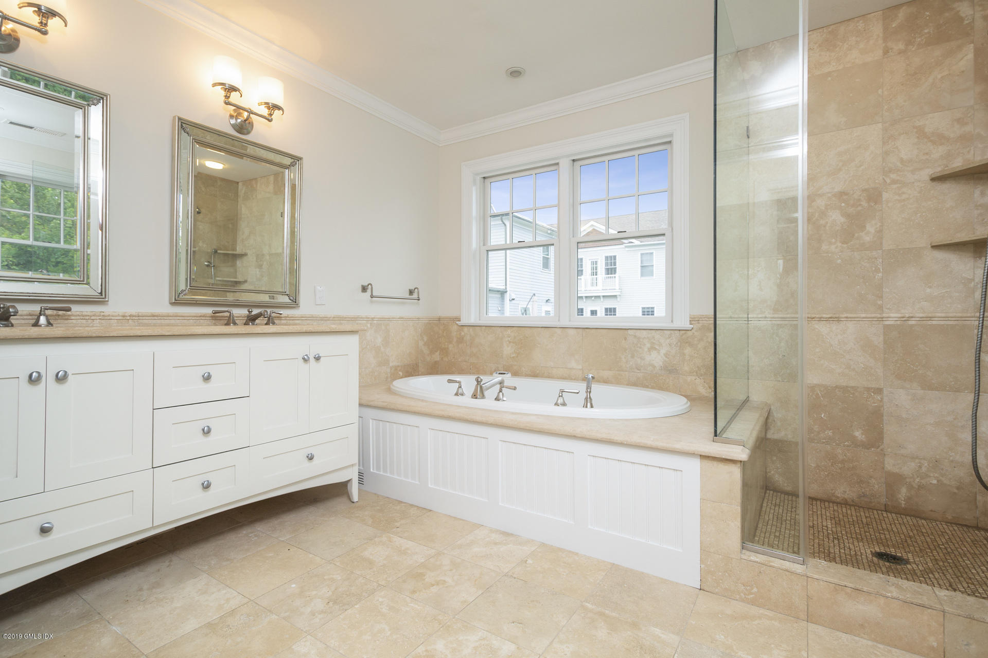 146 East Elm Street, Unit B Greenwich, CT 06830 - Photo 12 of 21 a bathroom with a tub a sink and a shower