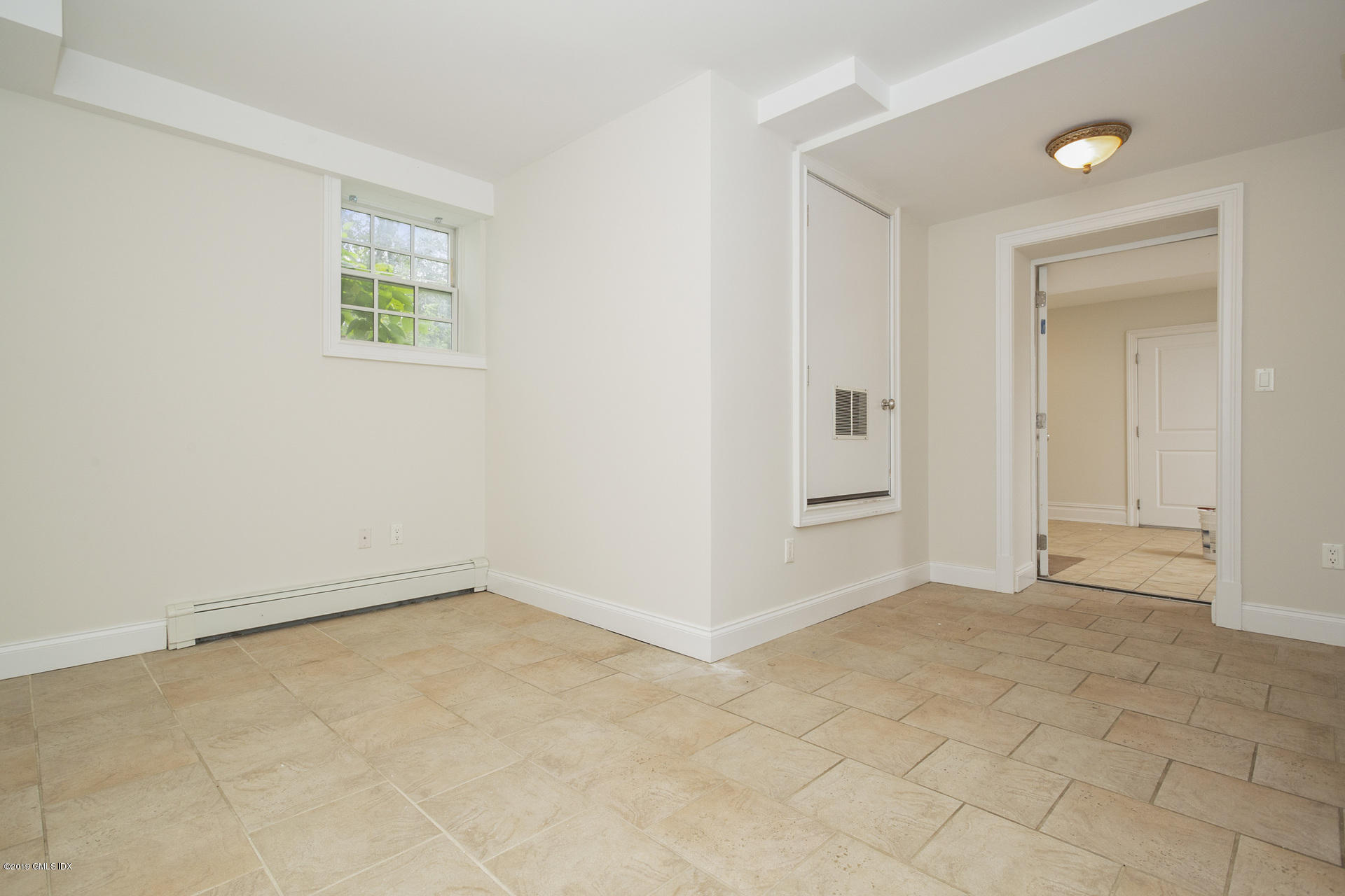 146 East Elm Street, Unit B Greenwich, CT 06830 - Photo 17 of 21 an empty room with windows