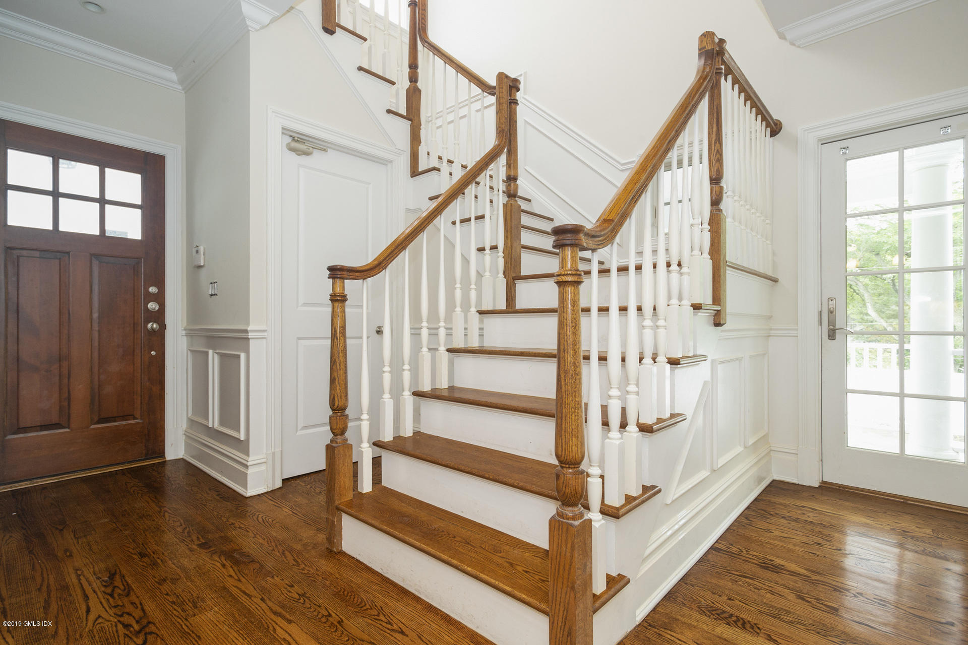 146 East Elm Street, Unit B Greenwich, CT 06830 - Photo 3 of 21 a view of entryway with wooden floor and stairs