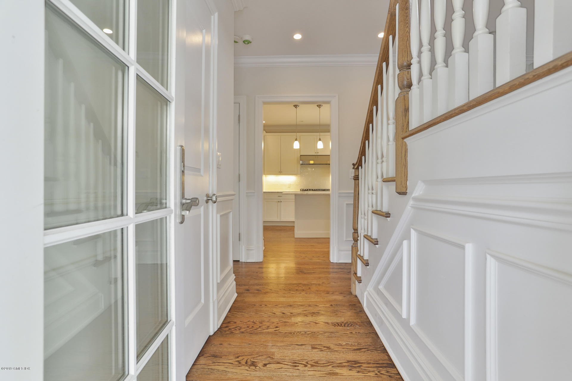 146 East Elm Street, Unit B Greenwich, CT 06830 - Photo 6 of 21 a view of a hallway with a white walls and stairs