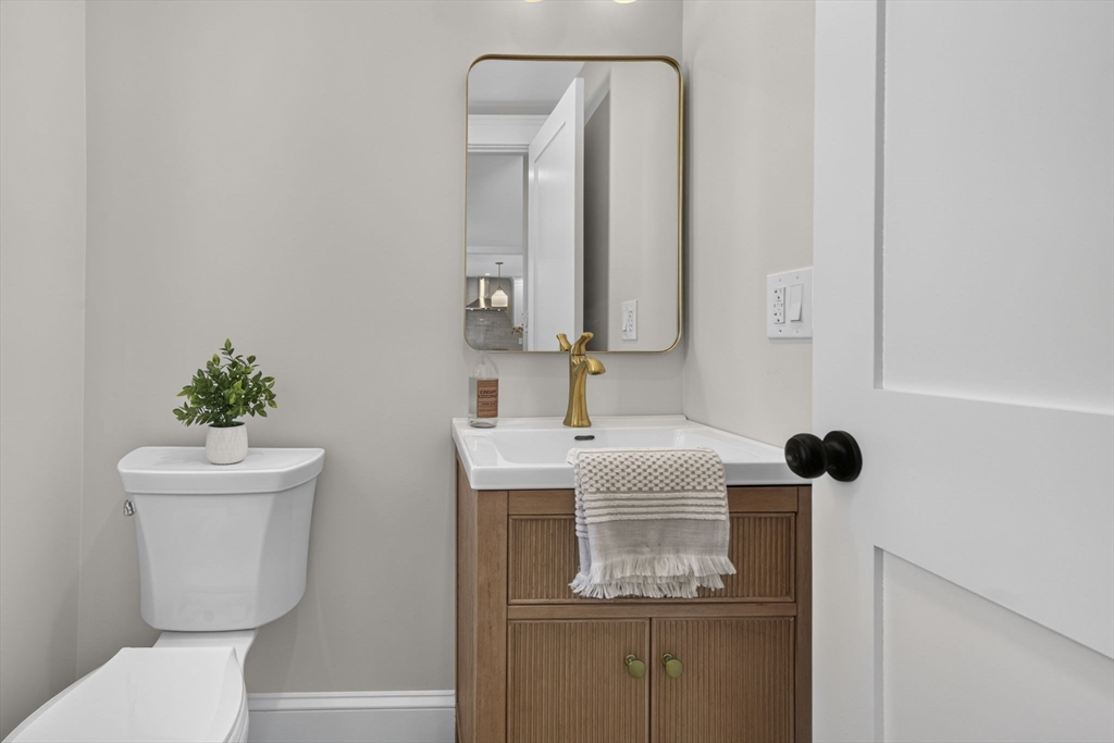 20 Saltonstall Road Medford, MA 02155 - Photo 19 of 41 a bathroom with a toilet sink and mirror
