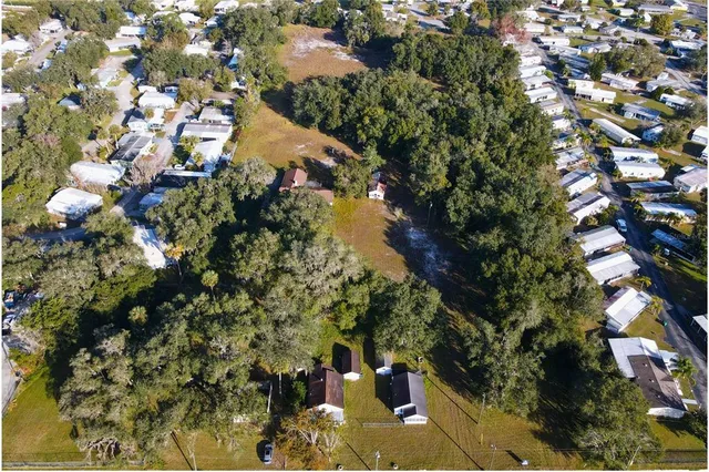 an aerial view of a residential apartment building with a city view