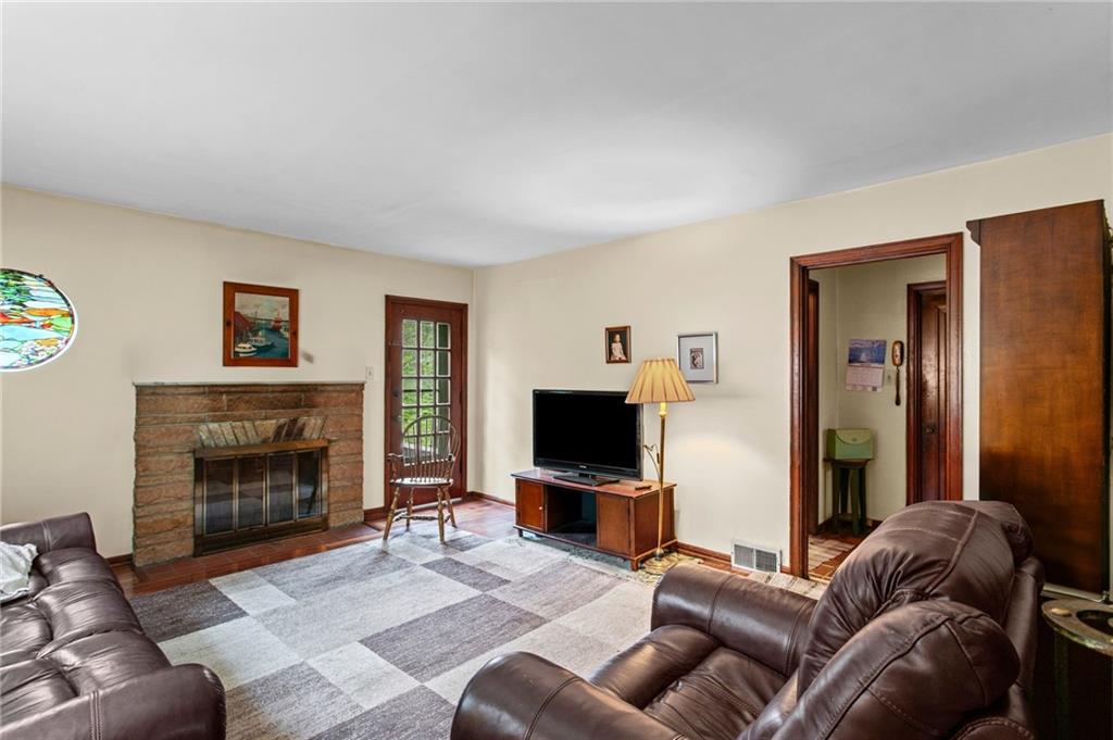 1445 Dutch Ridge Road Beaver, PA 15009 - Photo 21 of 43 a living room with furniture and a fireplace
