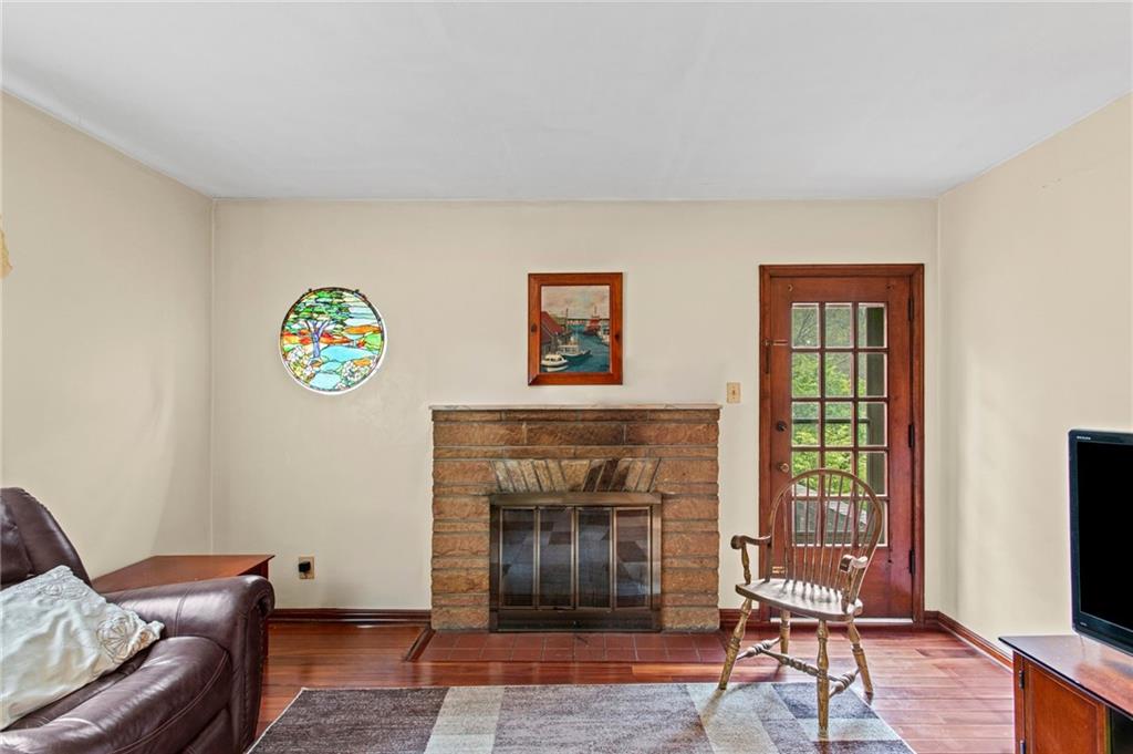 1445 Dutch Ridge Road Beaver, PA 15009 - Photo 22 of 43 a living room with furniture and a fireplace