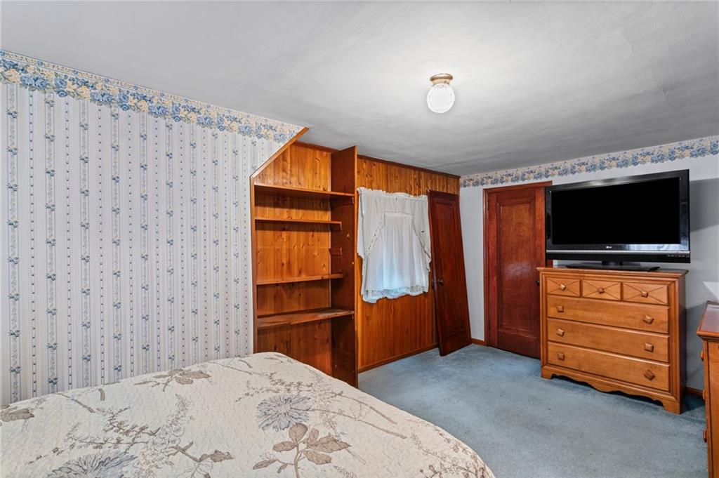 1445 Dutch Ridge Road Beaver, PA 15009 - Photo 37 of 43 a bedroom with a bed and flat screen tv