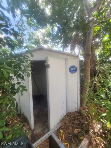 a view of a house with a tree