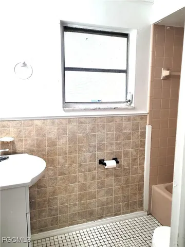 a bathroom with a sink and a shower
