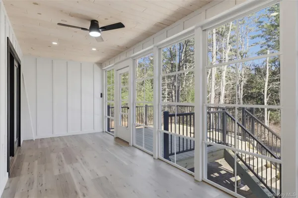 a view of entryway with wooden floor